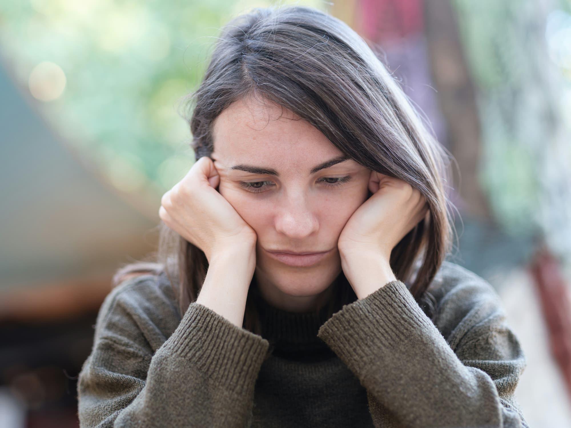 Person experiencing stomach discomfort due to stress