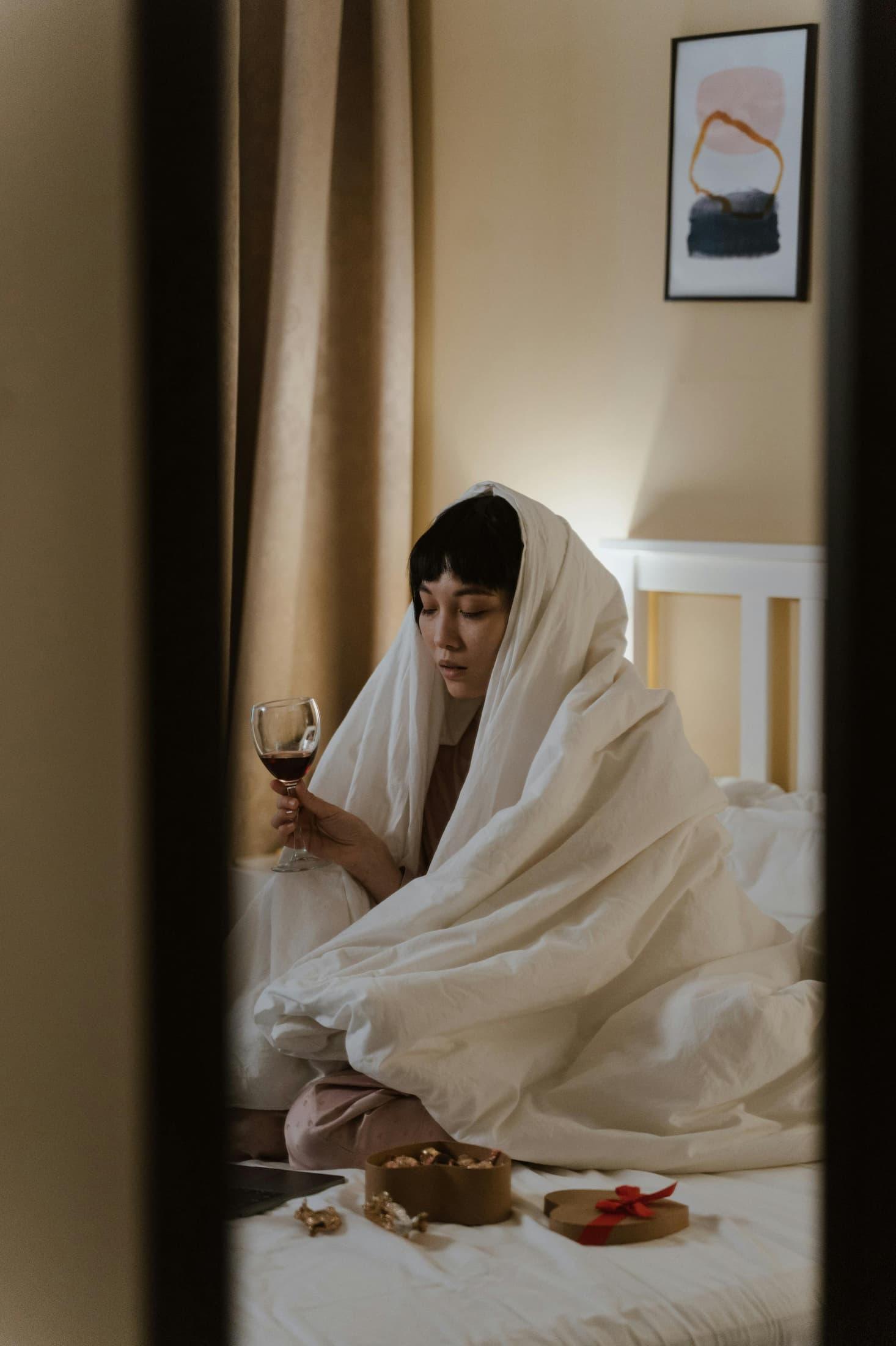 Person decompressing at home after socializing