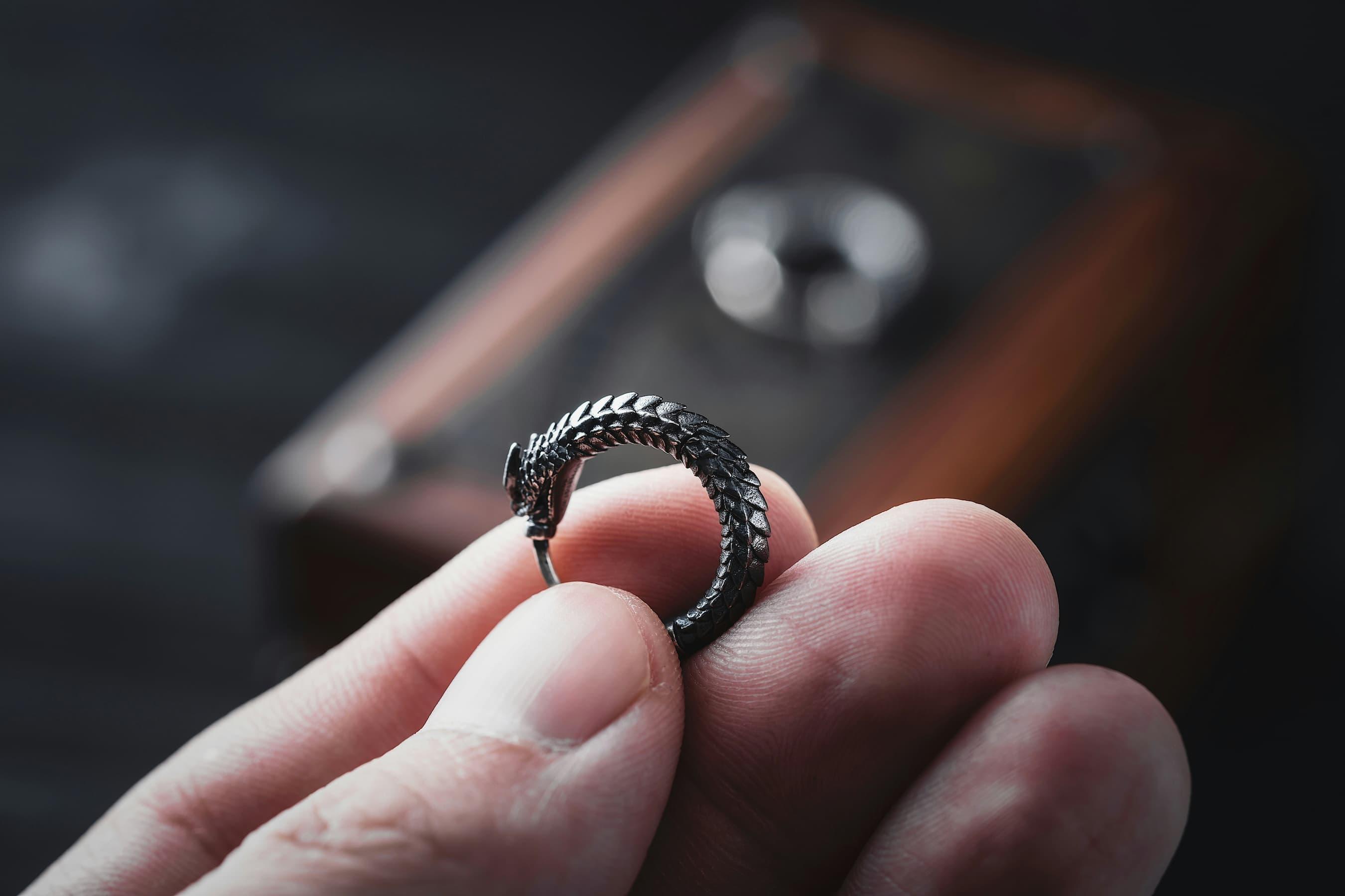 A variety of stylish fidget rings on a hand