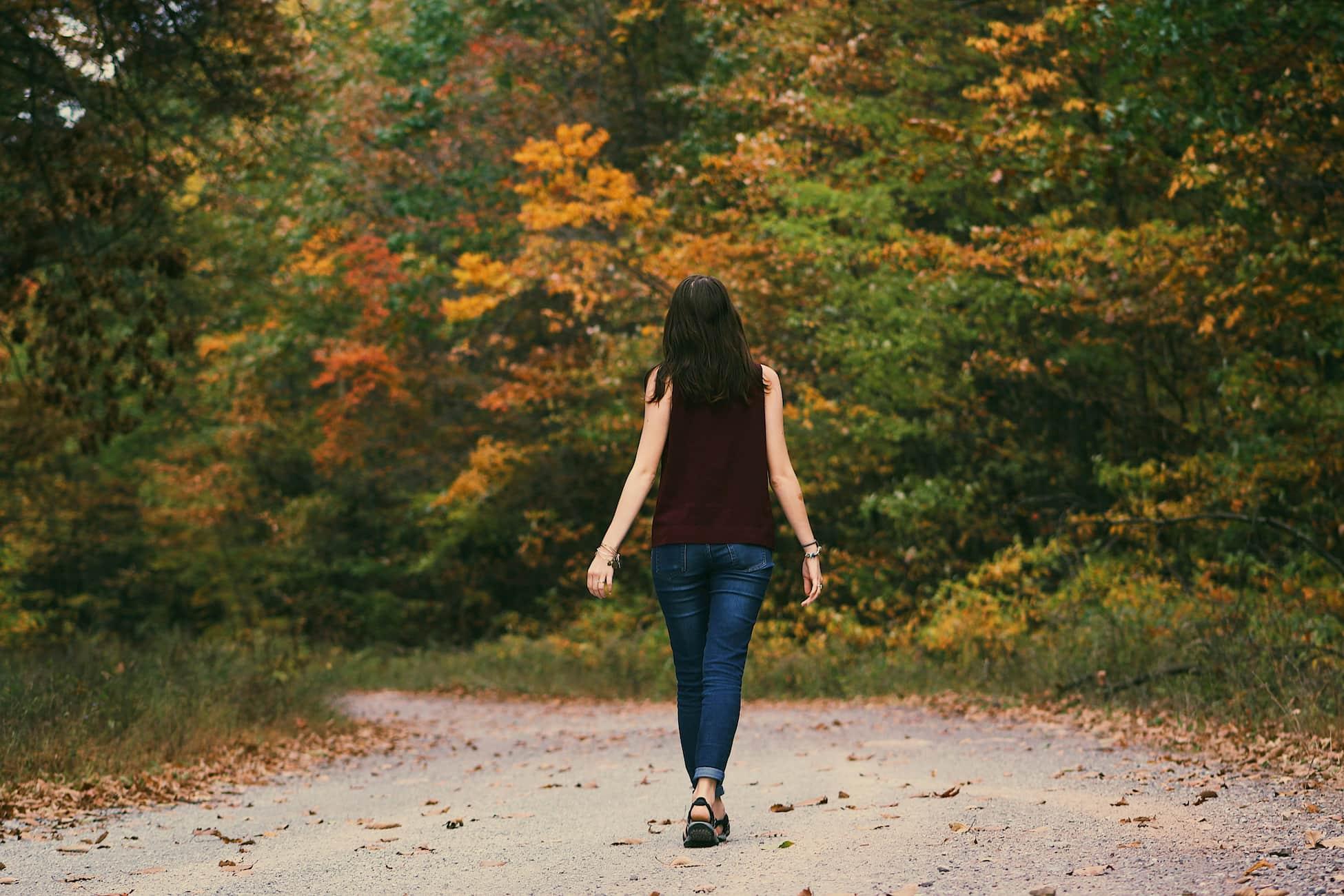 A person taking a walk in a park away from screens