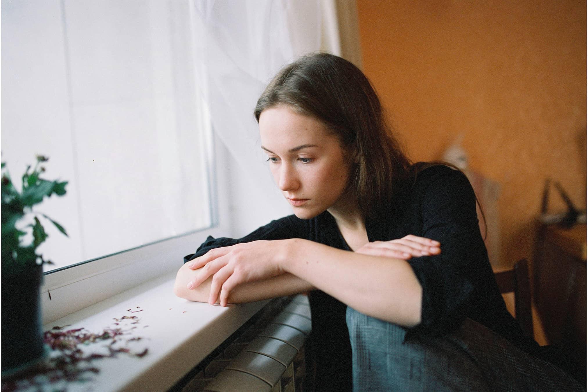 Person feeling overwhelmed by decisions